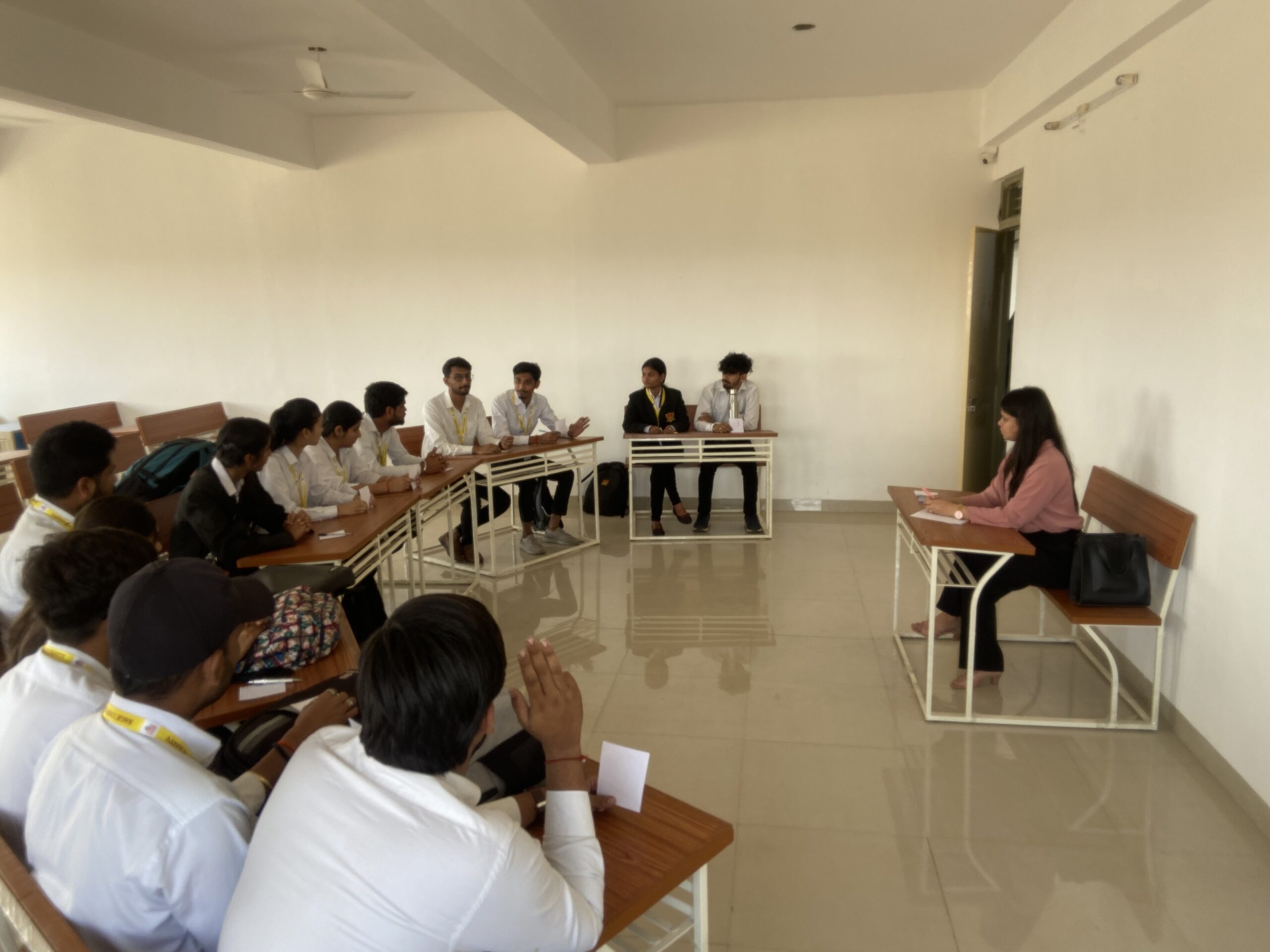 Campus Placement Training Program 4 Students participating in a group discussion practice round during campus placement training